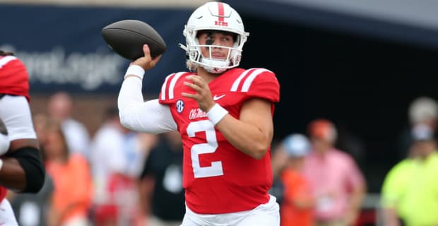 Ole Miss Rebels quarterback Jaxson Dart looks downfield during a college football game in the SEC.